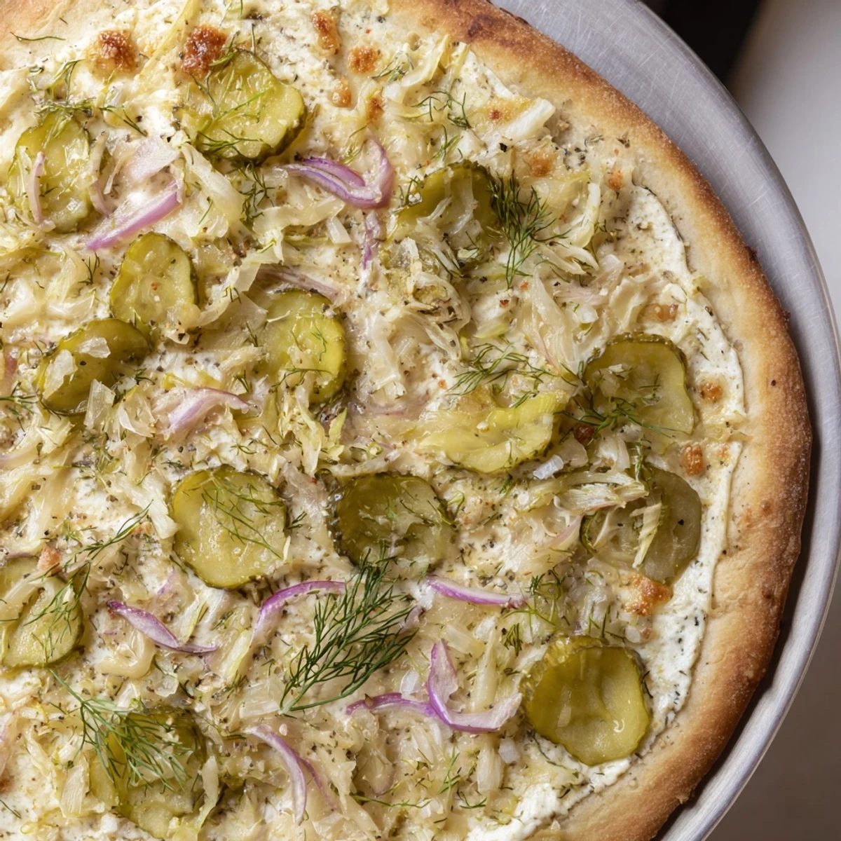 Creamy and tangy Pickle Pizza topped with crunchy dill pickles and mozzarella.  