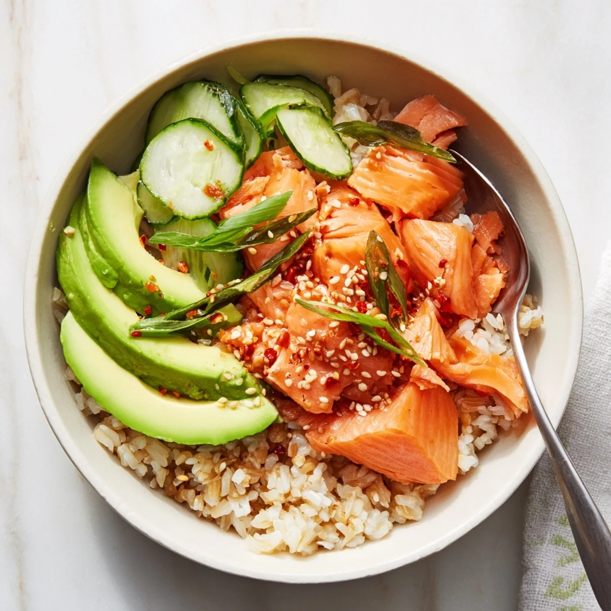 Revive your leftovers with this vibrant Leftover Salmon & Rice Bowl, topped with fresh veggies.  