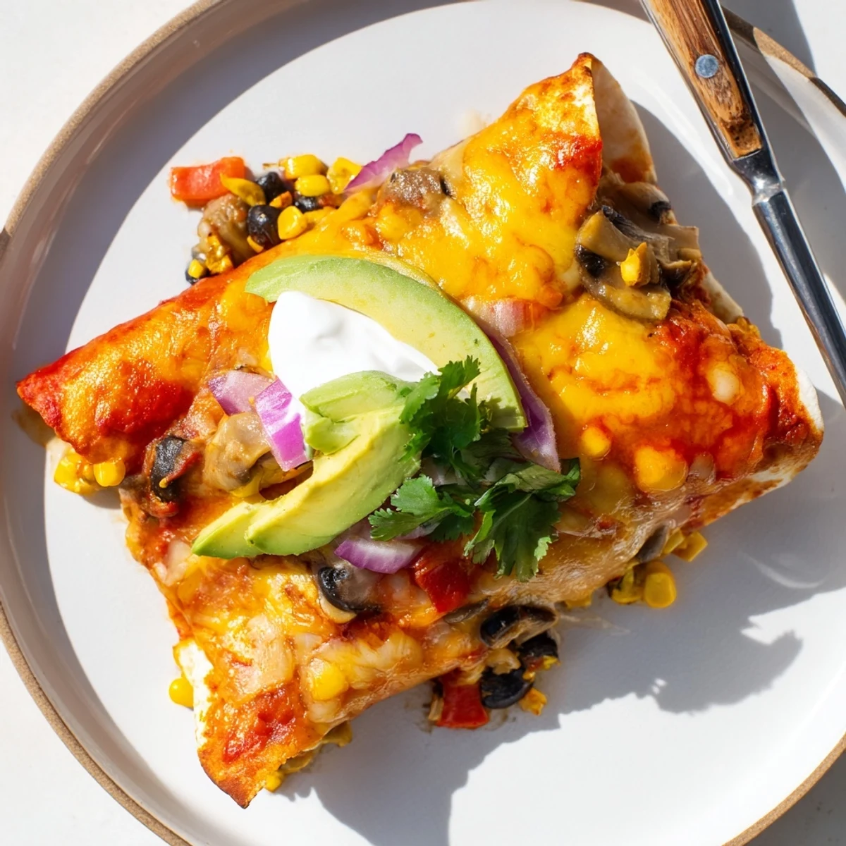 Colorful Farmers Market Vegetarian Enchiladas topped with melted cheese and fresh cilantro.  