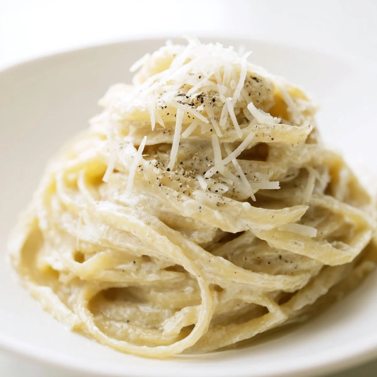 A visually appealing, close-up of golden Lazy Girl Three-Ingredient Pasta, ready to be enjoyed.