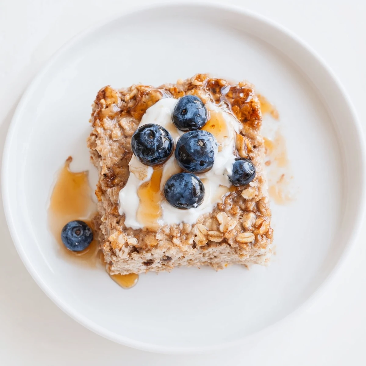 Fluffy Protein Pancake Oats, baked until golden, ready to slice and serve for a hearty breakfast.