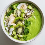 Creamy green smoothie bowl featuring fresh kale, avocado, and kiwi, a delightful vegan breakfast ready to eat.