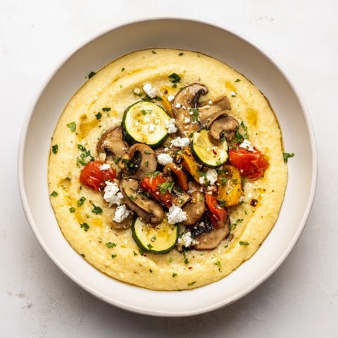 Creamy Cornmeal Mush Polenta Bowls, served warm with roasted veggies and herbs, are a delicious meal.