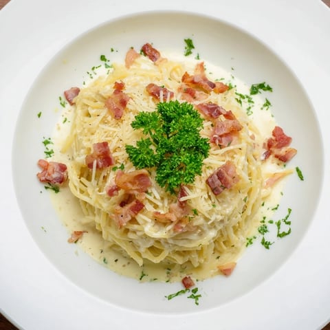 Carbonara Ramen Fusion: Creamy, cheesy ramen with crispy bacon and Parmesan cheese.