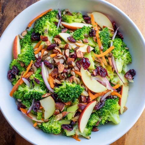 Fresh, colorful Broccoli and Apple Hot Girl Salad; crunchy apple slices and broccoli florets glistening in vinaigrette.