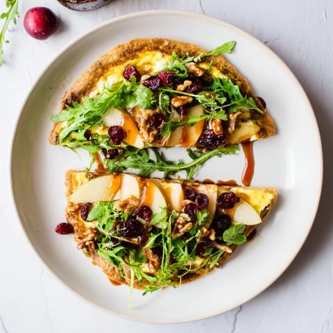 Cranberry Goat Cheese & Walnut Wrap, a vibrant filling in a whole wheat tortilla, ready to be enjoyed.