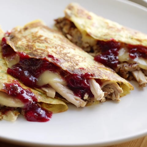 Golden, crispy Turkey, Stuffing & Cranberry leftovers tortilla wrap, a delicious holiday meal hack.