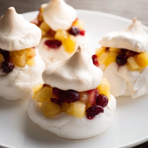 Cranberry and Pear Snowscape with golden meringue, a delightful dessert with tart fruit filling.