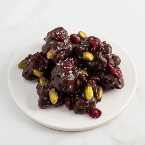 Gourmet Pistachio and Dried Cranberry Clusters, perfect for a holiday treat, are ready to enjoy.