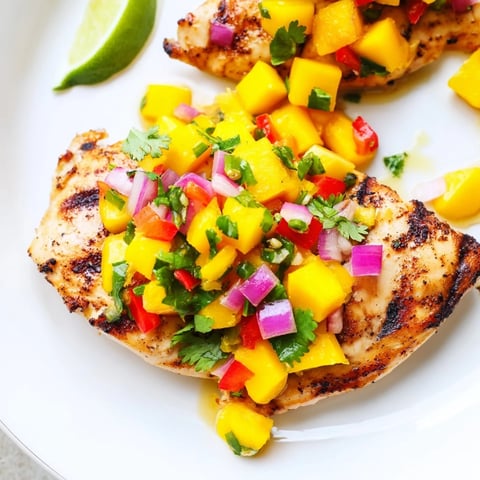 Grilled Mango Salsa Chicken with bright, colorful salsa ready to be served and enjoyed tonight!