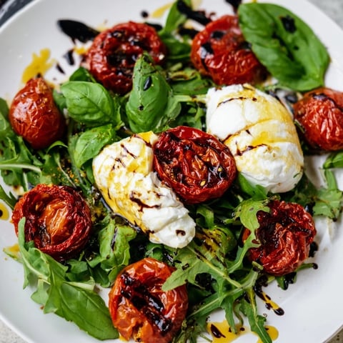 Vibrant Tomato Flight Salad with roasted tomatoes, creamy burrata, and fresh basil, a delicious Italian-inspired starter.