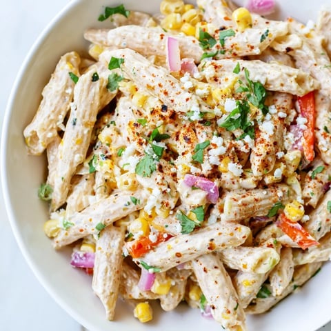Creamy Mexican Street Corn Pasta, a flavorful vegetarian side with charred corn and cotija cheese.