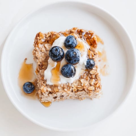 Fluffy Protein Pancake Oats, baked until golden, ready to slice and serve for a hearty breakfast.