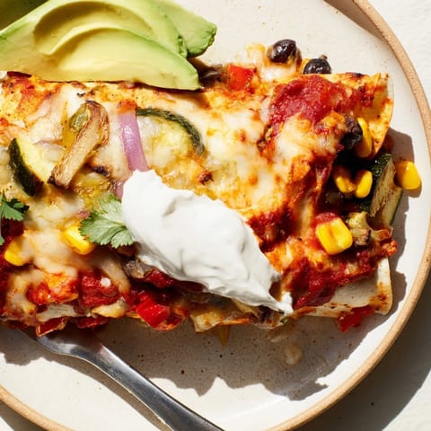 Delicious homemade Farmers Market Vegetarian Enchiladas bursting with vibrant seasonal vegetables.  