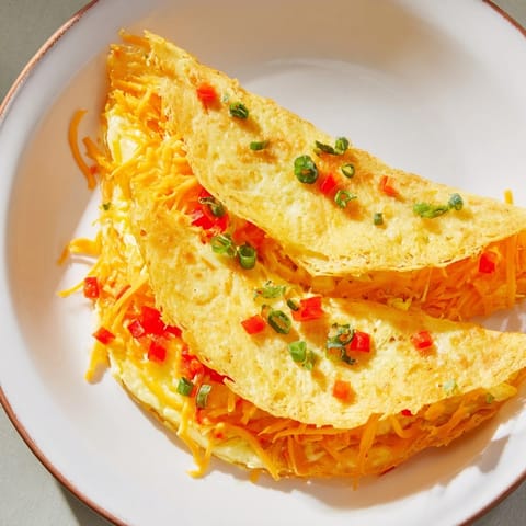 A crispy Rice Paper Egg Cheese Wrap, showcasing a delightful blend of egg and melted cheese.