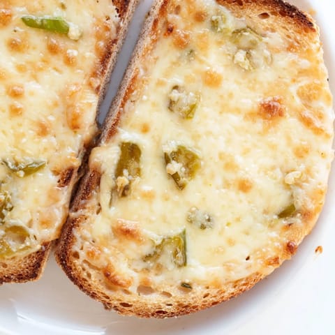 This spicy Jalapeño Pepper Jack Grilled Cheese is served hot with a side of tomato soup for dipping.  