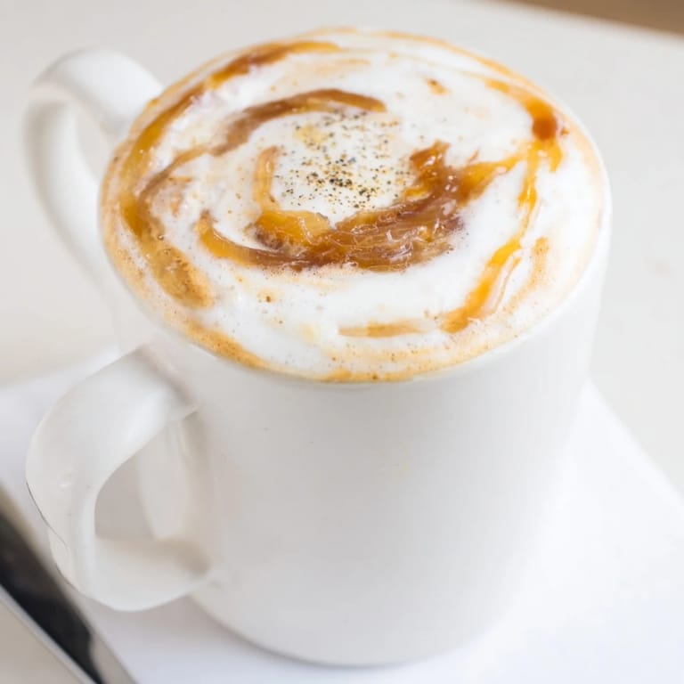 Savory Onion Latte combining sweet onion purée and frothed milk for unique flavor.  