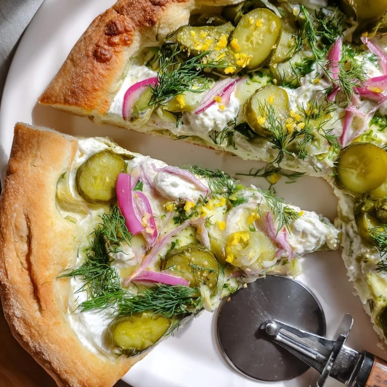 Deliciously unique Pickle Pizza with crème fraîche and fresh dill for flavor.  
