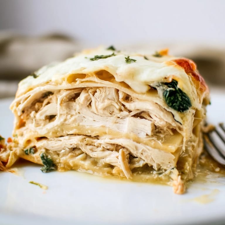 Deliciously cheesy rosemary chicken lasagna, perfect for family dinners and gatherings.